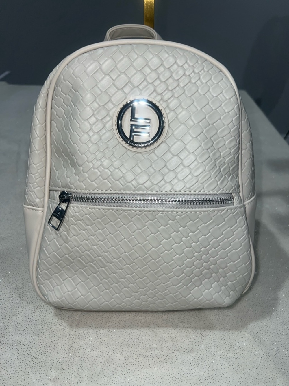 London Fog Stone colored Textured Backpack purse with Silver Logo NWT